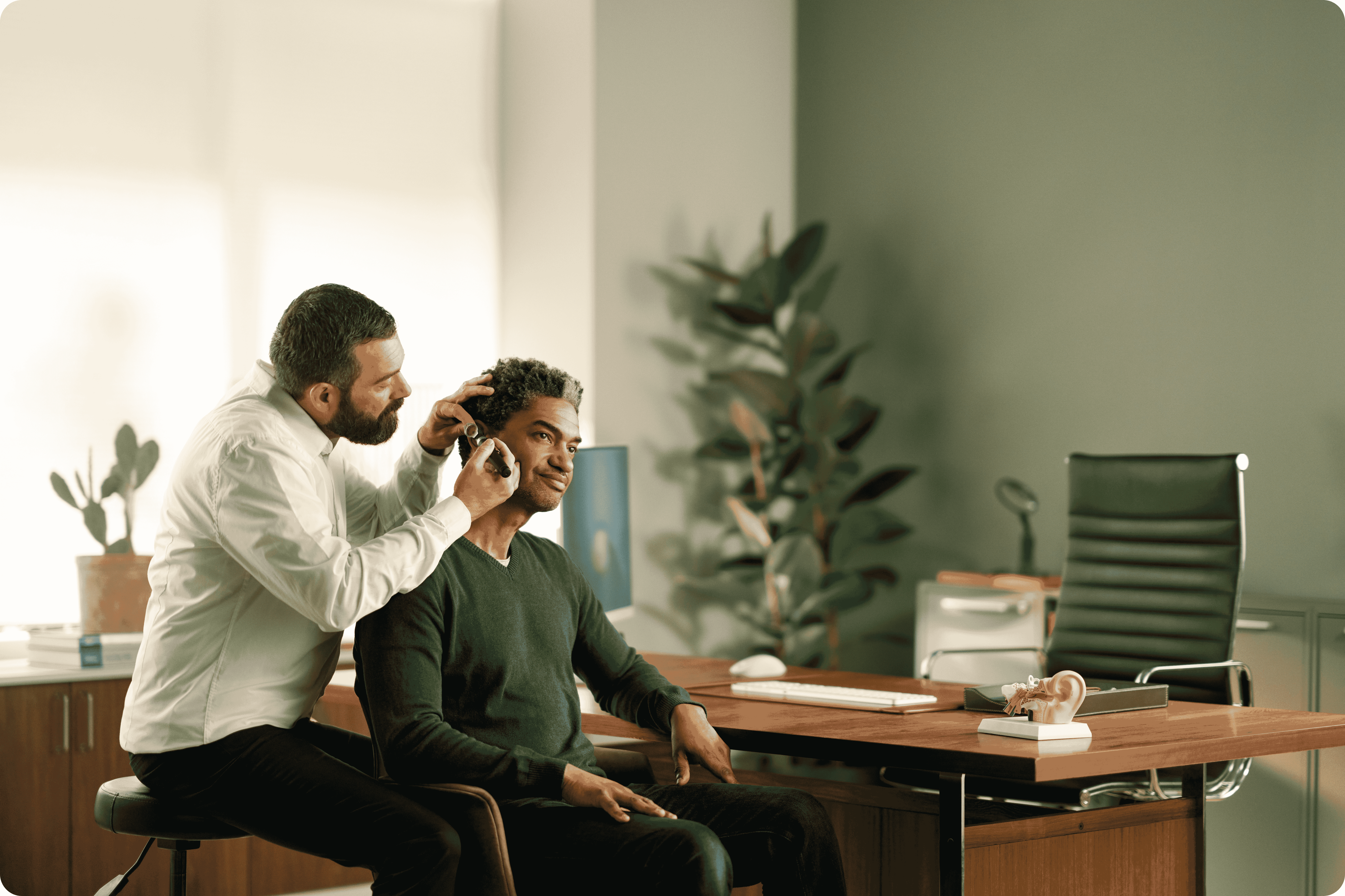 Audiologist with patient